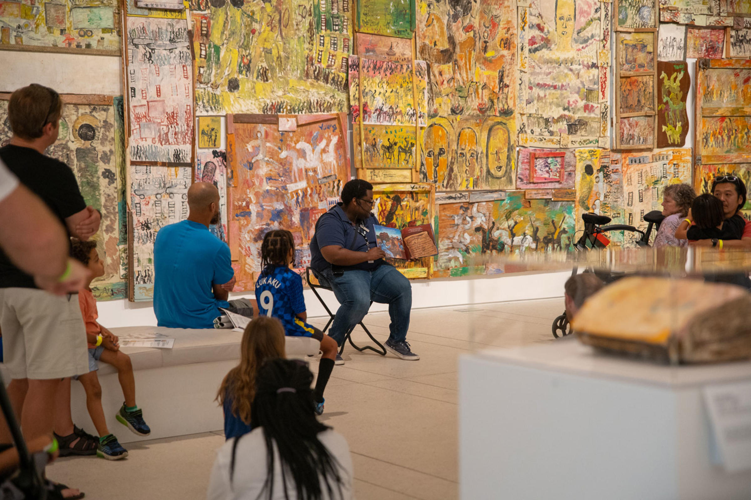 Tampa Museum of Art staff reads a children's book as part of a Family Day activity in the galleries